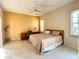 Relaxing bedroom with tiled floors, neutral tones, and workspace at 25 Windsor Dr, Englewood, FL 34223