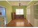 Bright bedroom with wood floors and built-in shelving at 25 Windsor Dr, Englewood, FL 34223