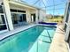 Refreshing pool with a screened enclosure and patio at 25 Windsor Dr, Englewood, FL 34223