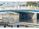 Concrete bridge over canal with blue pipes at 3911 Sunrise S Dr, St Petersburg, FL 33705