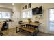 Kitchen breakfast nook with rustic wood table and bench seating at 3911 Sunrise S Dr, St Petersburg, FL 33705