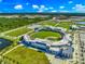 Aerial view of a baseball stadium with surrounding parking and fields at 4625 Pan American Blvd, North Port, FL 34287