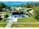 Aerial view of single-story home with solar panels, pool, and spacious yard at 4625 Pan American Blvd, North Port, FL 34287