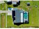 Aerial view of a house with solar panels and a pool at 4625 Pan American Blvd, North Port, FL 34287