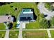 Aerial view of a house with solar panels, pool, and driveway at 4625 Pan American Blvd, North Port, FL 34287