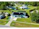 Aerial view of single-story home with solar panels, pool, and spacious yard at 4625 Pan American Blvd, North Port, FL 34287