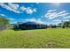 Expansive grassy backyard, offering ample space and privacy at 4625 Pan American Blvd, North Port, FL 34287