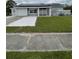 One-story home with solar panels, attached garage, and landscaped lawn at 4625 Pan American Blvd, North Port, FL 34287