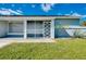 Home exterior featuring a screened entryway and modern door at 4625 Pan American Blvd, North Port, FL 34287