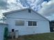 House exterior with a water softener and window at 4625 Pan American Blvd, North Port, FL 34287