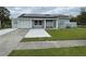 House exterior with solar panels and a driveway at 4625 Pan American Blvd, North Port, FL 34287