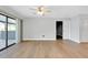 Living room with sliding glass doors and wood-look floors at 4625 Pan American Blvd, North Port, FL 34287