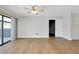 Living room with sliding glass doors and wood-look floors at 4625 Pan American Blvd, North Port, FL 34287