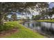 Community clubhouse with pond and fountain; enjoy resort-style living! at 885 Country Club Cir # 61, Venice, FL 34293