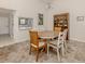 Elegant dining room with a round table and wooden chairs at 885 Country Club Cir # 61, Venice, FL 34293