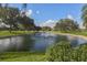 Serene pond with fountain in a lush green landscape at 885 Country Club Cir # 61, Venice, FL 34293