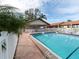 Inviting pool area with covered seating and tables at 885 Country Club Cir # 61, Venice, FL 34293