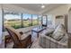 Relaxing sunroom with wicker furniture, offering a tranquil view at 885 Country Club Cir # 61, Venice, FL 34293