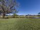 Tranquil waterfront view of homes and lake at 885 Country Club Cir # 61, Venice, FL 34293