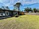 Large backyard, deck, and grassy area at 129 Gulf Ave, Nokomis, FL 34275