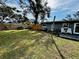 Spacious backyard with grassy lawn and wooden fence at 129 Gulf Ave, Nokomis, FL 34275