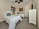 Two twin beds, nightstands, and a dresser in a well-lit bedroom at 20126 Elegante Ct, Venice, FL 34293