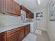 Bright laundry room with built-in cabinets and countertop at 20126 Elegante Ct, Venice, FL 34293