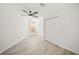 Bright bedroom featuring ceiling fan, window, and sliding closet doors at 606 Marcus St # 26, Venice, FL 34285