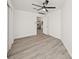 Spacious bedroom with ceiling fan and wood-look flooring at 606 Marcus St # 26, Venice, FL 34285