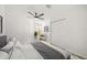 Cozy bedroom with ceiling fan, large closet, and comfortable seating area at 606 Marcus St # 26, Venice, FL 34285