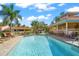 Inviting community pool with plenty of lounge chairs at 606 Marcus St # 26, Venice, FL 34285