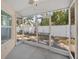 Relaxing screened porch overlooks backyard with privacy fence at 606 Marcus St # 26, Venice, FL 34285