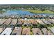 Aerial view of houses and a lake at 620 Lakescene Dr, Venice, FL 34293