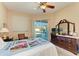 Charming bedroom with backyard access and a dresser at 620 Lakescene Dr, Venice, FL 34293