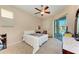 Comfortable bedroom with sliding door access to the pool area at 620 Lakescene Dr, Venice, FL 34293