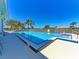 Relaxing community pool with surrounding lounge chairs at 620 Lakescene Dr, Venice, FL 34293