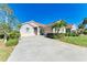 Single-story house with a two car garage at 620 Lakescene Dr, Venice, FL 34293