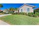 One-story home with a landscaped lawn at 620 Lakescene Dr, Venice, FL 34293
