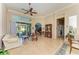 Bright Gathering room with tiled floors, comfy seating, and access to the backyard at 620 Lakescene Dr, Venice, FL 34293