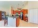 Updated kitchen with wood cabinets, granite countertops, and breakfast bar at 620 Lakescene Dr, Venice, FL 34293
