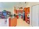 Modern kitchen with wood cabinets, granite counters and stainless steel appliances at 620 Lakescene Dr, Venice, FL 34293