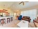 Comfortable living room with leather sofas and views into the kitchen at 620 Lakescene Dr, Venice, FL 34293