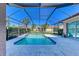 Screened-in pool with a concrete patio at 620 Lakescene Dr, Venice, FL 34293