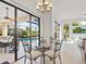 Casual dining area with glass table and view of the pool at 804 Amaryllis Ln, Venice, FL 34292