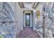 Front entry with stonework, a modern door and a sunflower decoration at 13097 Rinella St, Venice, FL 34293