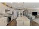 Spacious kitchen island with seating and a view to the living room at 13097 Rinella St, Venice, FL 34293
