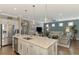 Modern kitchen with large island, stainless steel appliances, and quartz countertops at 13097 Rinella St, Venice, FL 34293