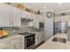 Well-equipped kitchen featuring stainless steel appliances and modern cabinetry at 13097 Rinella St, Venice, FL 34293