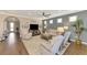 Living area with hardwood floors, neutral decor, and a view into the entryway at 13097 Rinella St, Venice, FL 34293