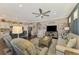 Open living space with hardwood floors, comfortable seating, and views of kitchen at 13097 Rinella St, Venice, FL 34293